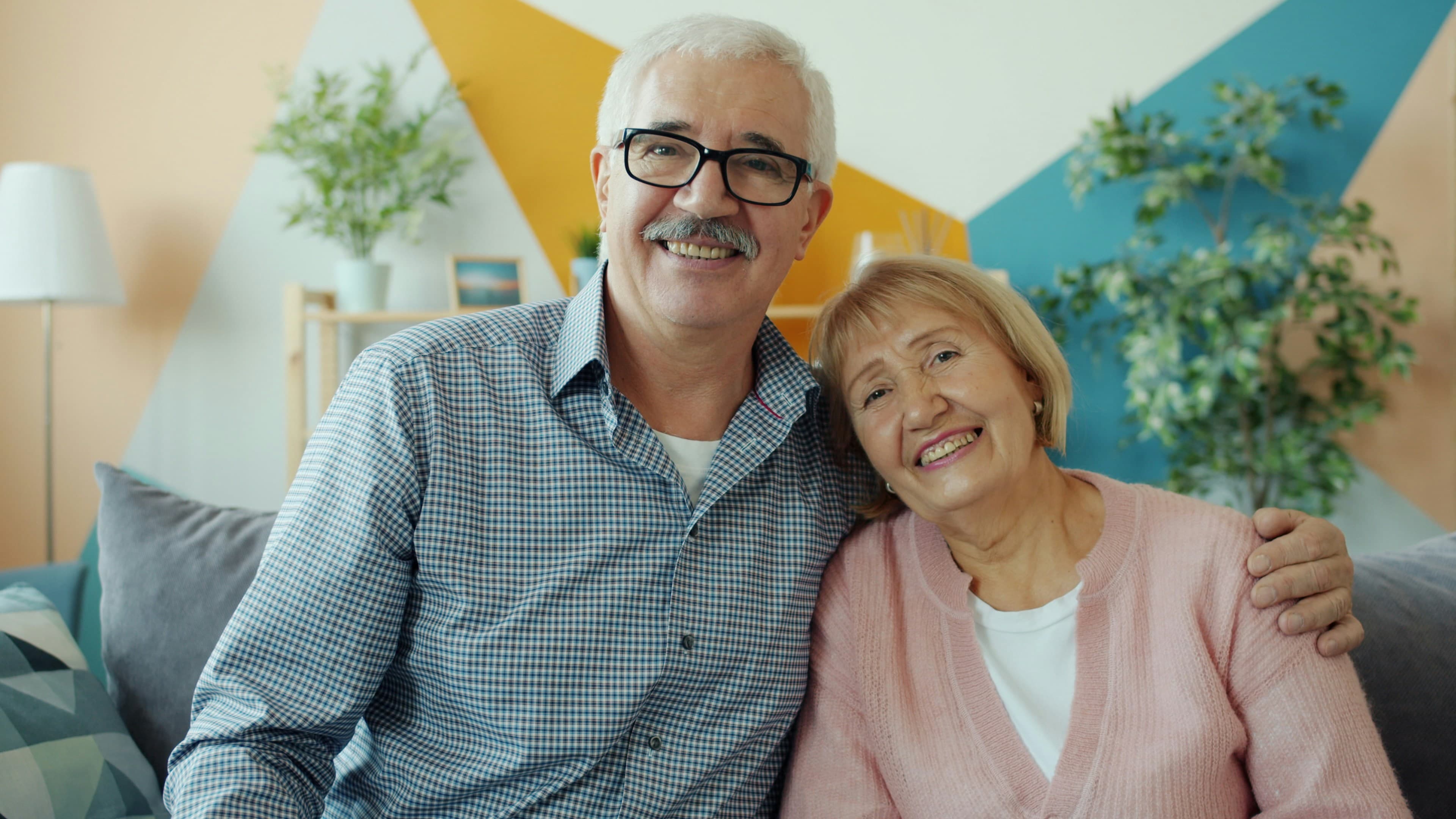 A couple smiling together at home
